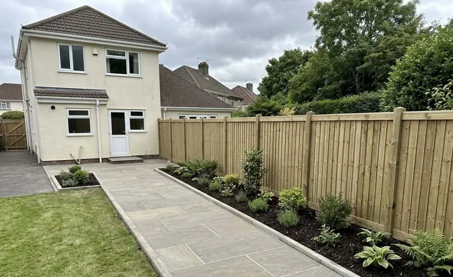 Indian sandstone garden path with new closeboard fencing and planted borders, landscaping in Cardiff