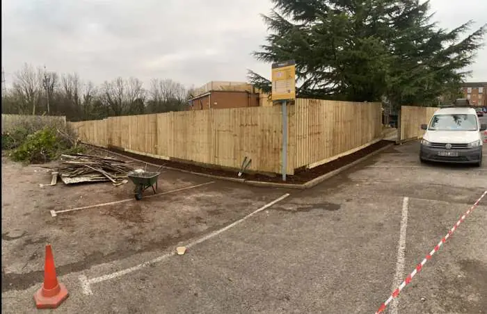 Commercial closeboard fencing installation around a business car park