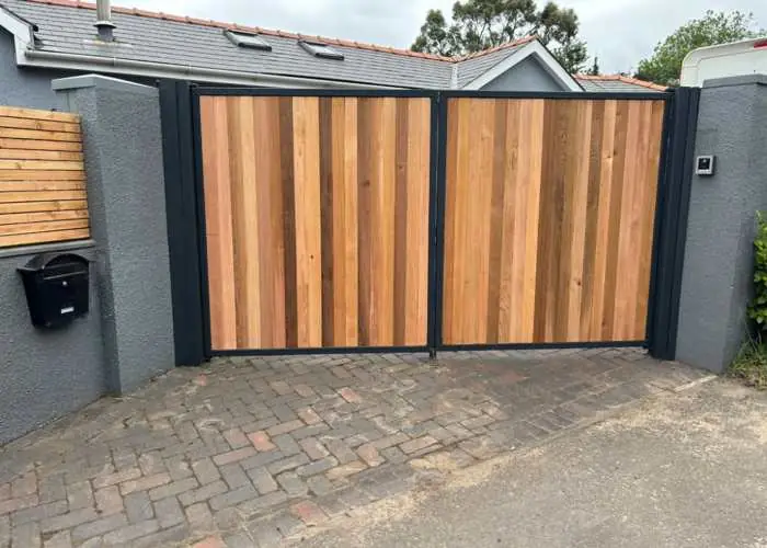 Steel framed double driveway gates with timber infill