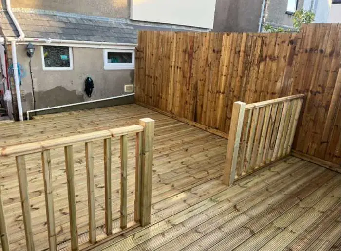 New timber decking with balustrade and closeboard fencing